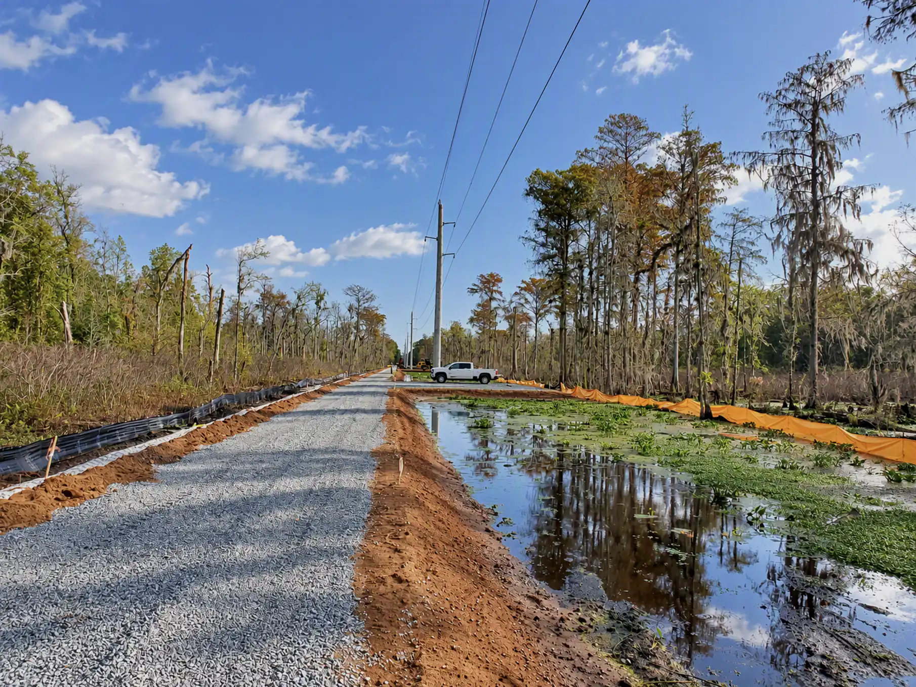 Stone access road built through wetland to reach a transmission line